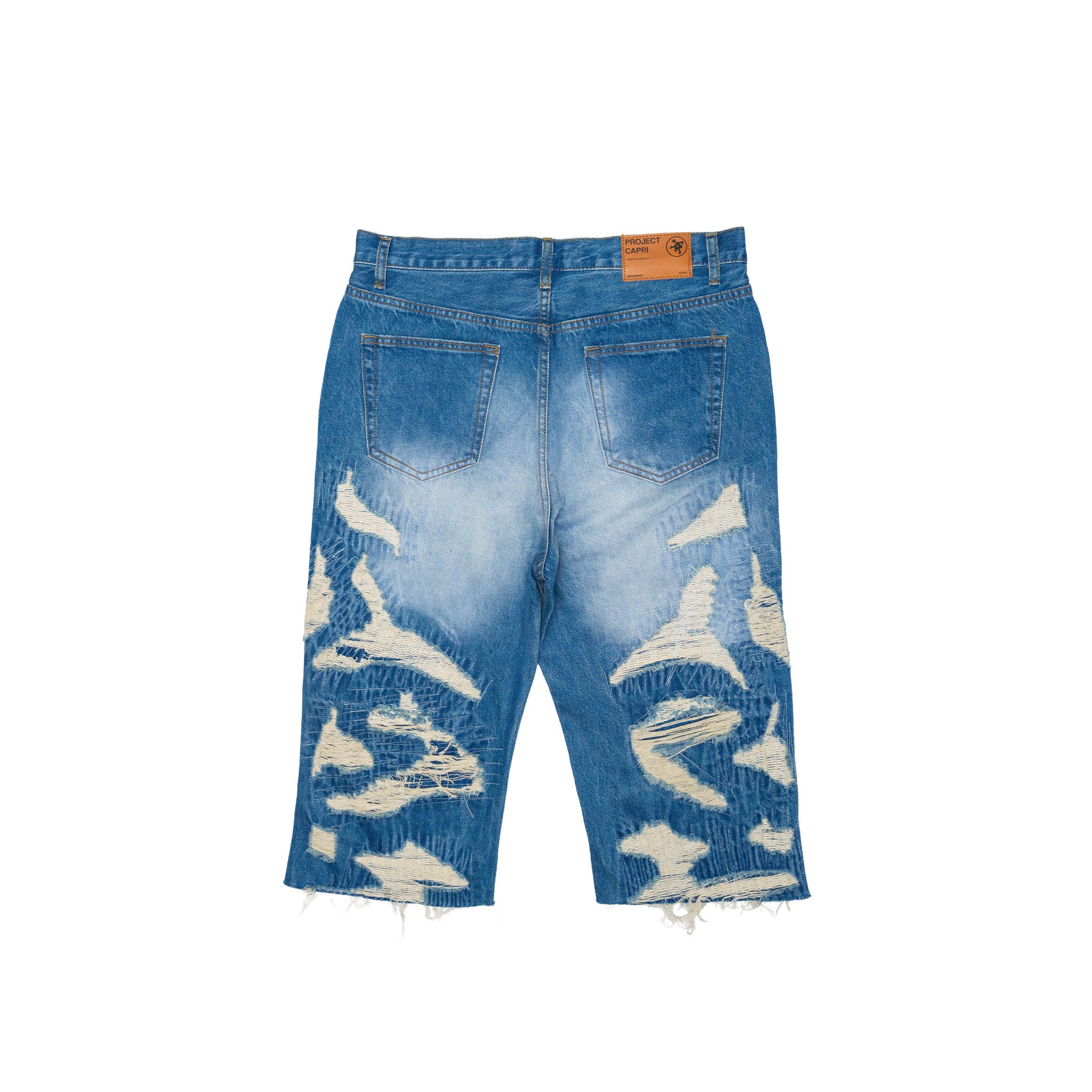 DISTRESSED CAPRI JORTS
